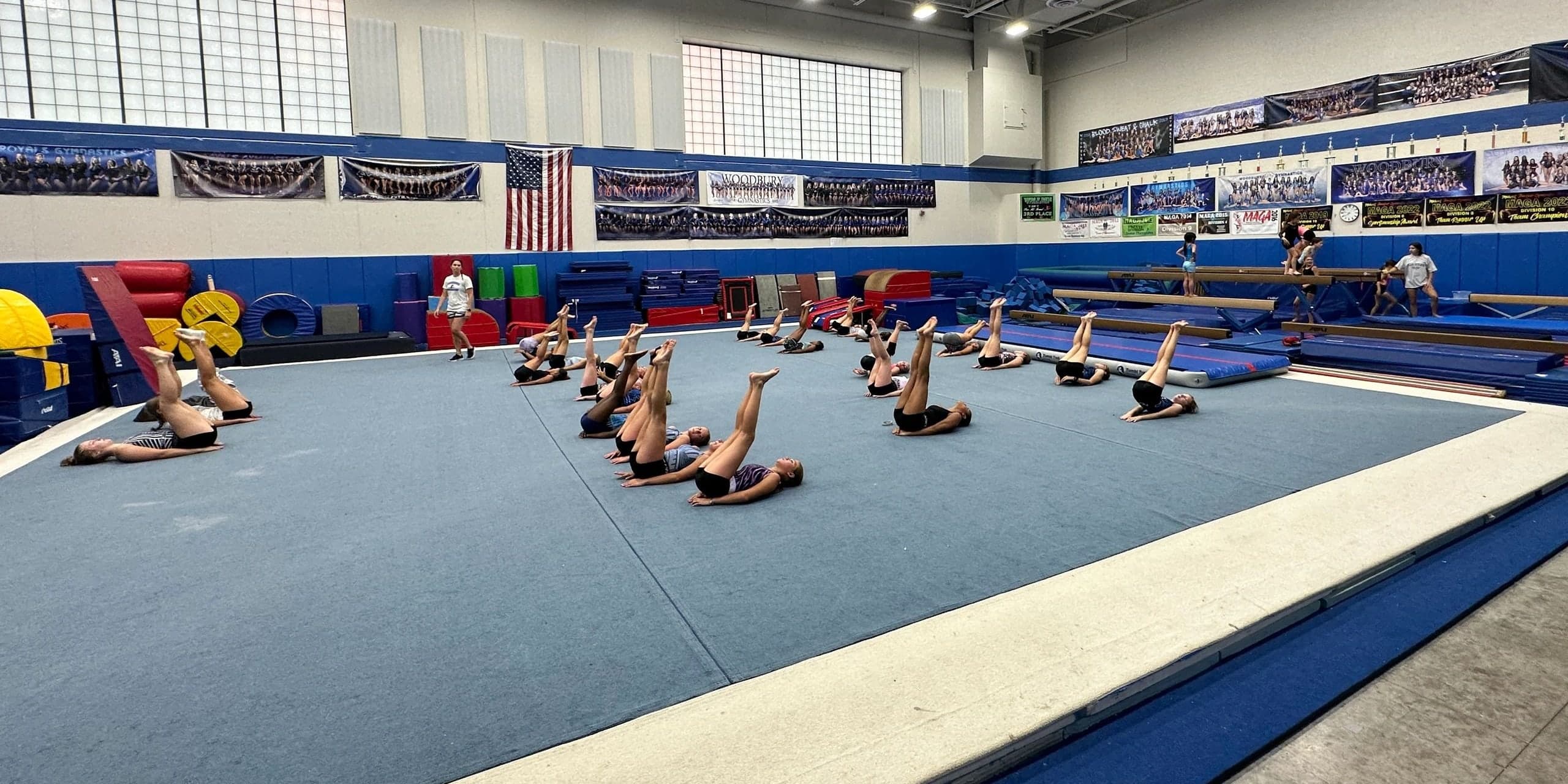 Gymnasts warming up on the floor at JO Gymnastics in Woodbury, Minnesota